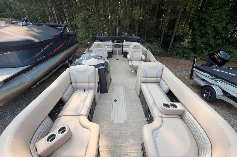 Slide: The Image of Luxurious 2023 Crest Caribbean 250 SLC pontoon boat with spacious seating and modern design. - 4
