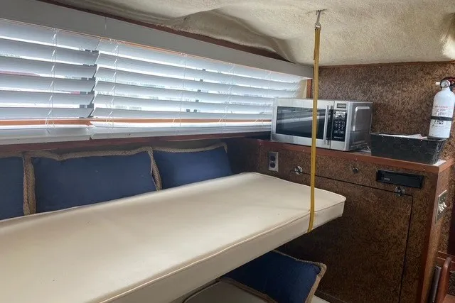 Slide: The Image of Interior of a 1975 Slickcraft 28 EXPRESS boat with seating, microwave, and fire extinguisher. - 12
