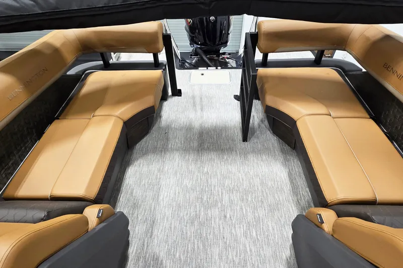 Slide: The Image of Interior of 2026 Bennington 22M Open FSB boat with tan seating and modern design. - 10