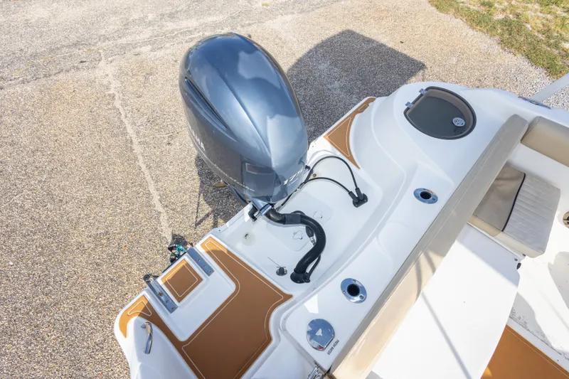 Slide: The Image of 2016 Sea Fox 226 Traveler boat with outboard motor and seating area. - 45