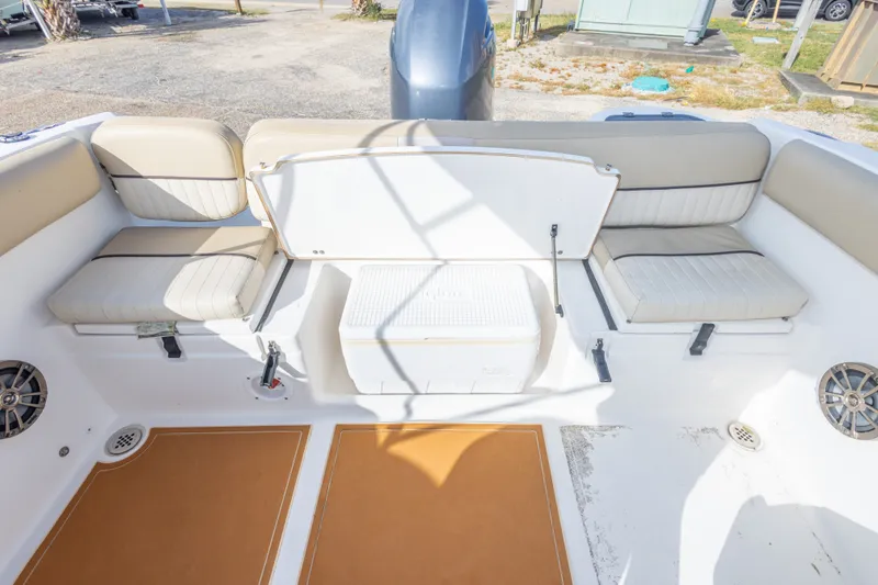 Slide: The Image of 2016 Sea Fox 226 Traveler boat interior with cushioned seating and storage compartment. - 42