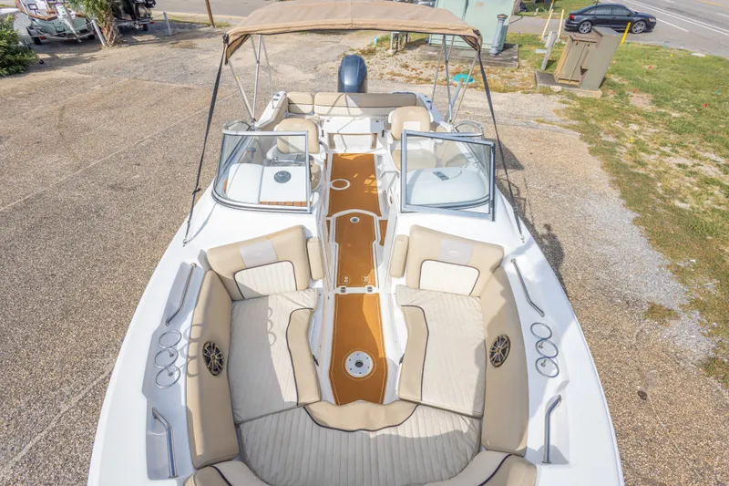Slide: The Image of 2016 Sea Fox 226 Traveler boat with spacious seating and canopy, parked on gravel. - 32
