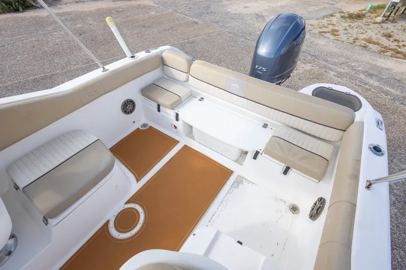 Slide: The Image of 2016 Sea Fox 226 Traveler boat interior with seating and Yamaha 175 engine. - 39