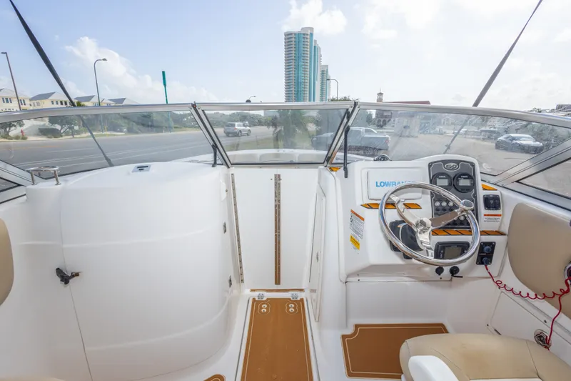 Slide: The Image of 2016 Sea Fox 226 Traveler boat cockpit with steering wheel and control panel. - 35