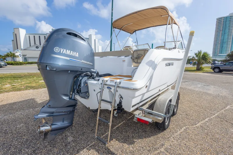 Slide: The Image of 2016 Sea Fox 226 Traveler boat with Yamaha engine on trailer, parked outdoors. - 16