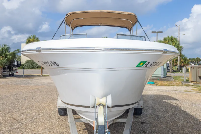 Slide: The Image of 2016 Sea Fox 226 Traveler boat on trailer, parked outdoors under cloudy sky. - 23