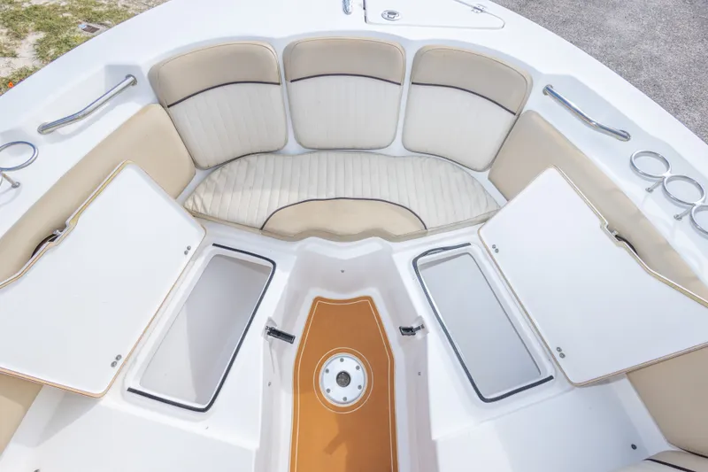Slide: The Image of 2016 Sea Fox 226 Traveler boat interior with cushioned seating and storage compartments. - 34