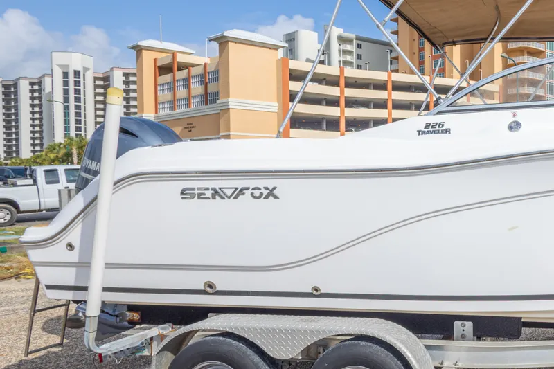 Slide: The Image of 2016 Sea Fox 226 Traveler boat on trailer, urban background. - 21