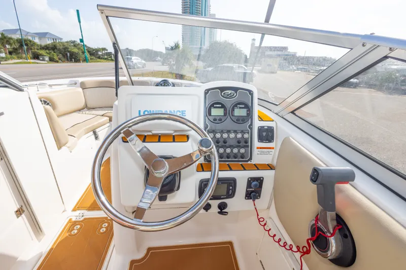 Slide: The Image of Interior view of 2016 Sea Fox 226 Traveler boat cockpit with steering wheel and controls. - 37