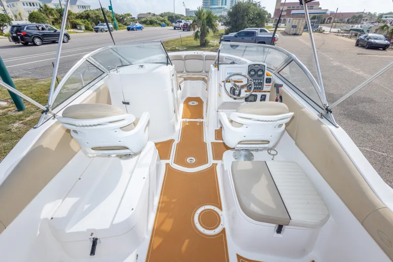 Slide: The Image of 2016 Sea Fox 226 Traveler boat interior with beige seating and modern dashboard. - 26