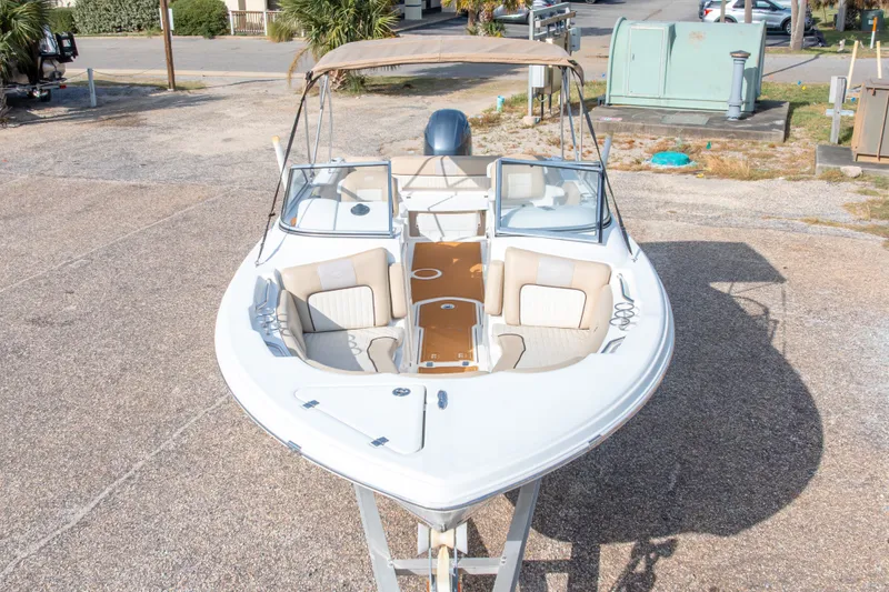 Slide: The Image of 2016 Sea Fox 226 Traveler boat with beige seating and canopy, parked on a trailer. - 5