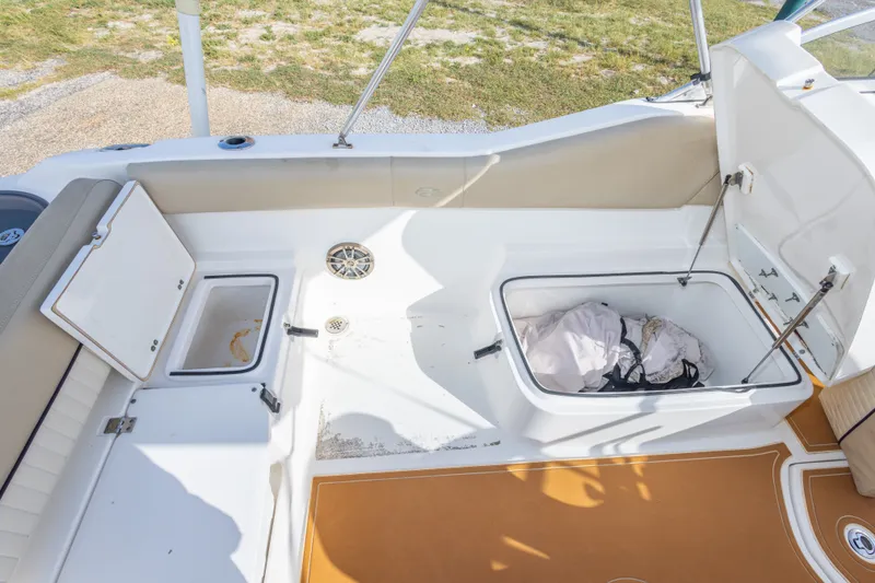 Slide: The Image of 2016 Sea Fox 226 Traveler boat interior with storage compartments open. - 41