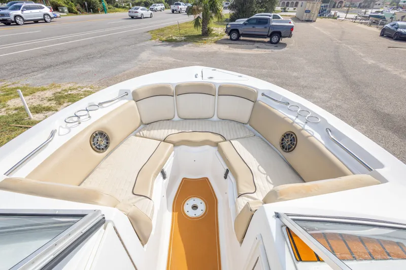 Slide: The Image of 2016 Sea Fox 226 Traveler boat interior with beige seating and cup holders. - 31