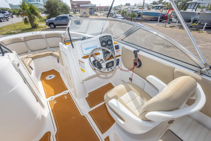 Slide: The Image of 2016 Sea Fox 226 Traveler boat interior with steering wheel and seating. - 27