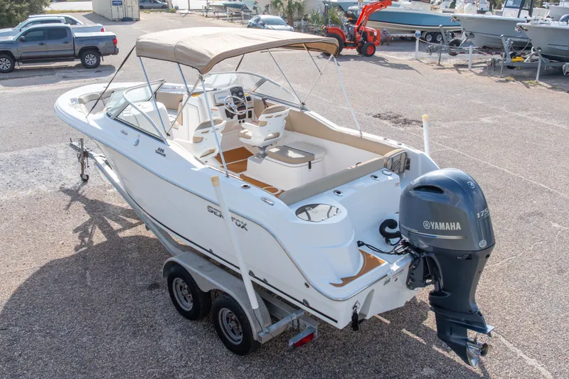 Slide: The Image of 2016 Sea Fox 226 Traveler boat with Yamaha engine on trailer in marina. - 15