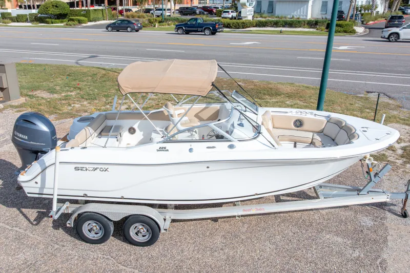 Slide: The Image of 2016 Sea Fox 226 Traveler boat on trailer, featuring Yamaha outboard motor. - 2