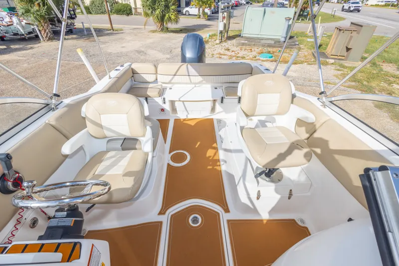 Slide: The Image of 2016 Sea Fox 226 Traveler boat interior with beige seating and steering wheel. - 36