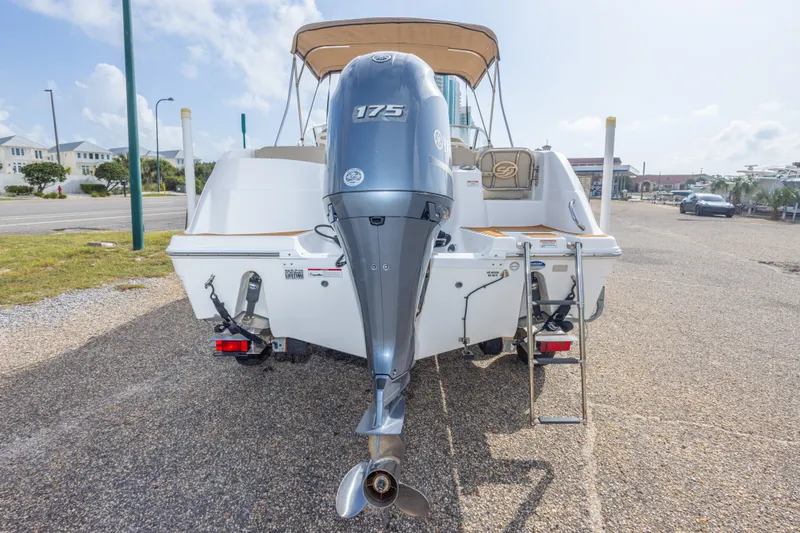 Slide: The Image of 2016 Sea Fox 226 Traveler boat with Yamaha 175 engine, parked on gravel. - 17