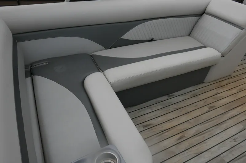 Slide: The Image of Luxurious seating on 2018 Crest II boat with sleek design and wooden flooring. - 10