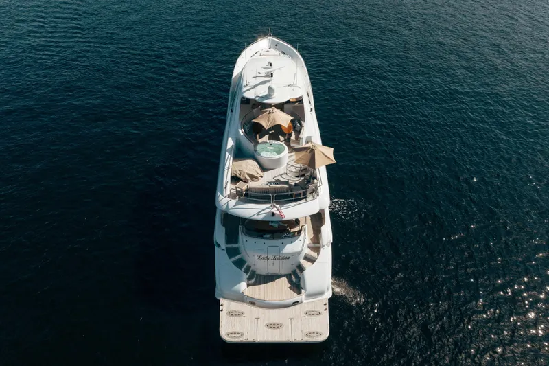 Slide: The Image of Aerial view of 2004 Lazzara 106 yacht cruising on open water. - 2