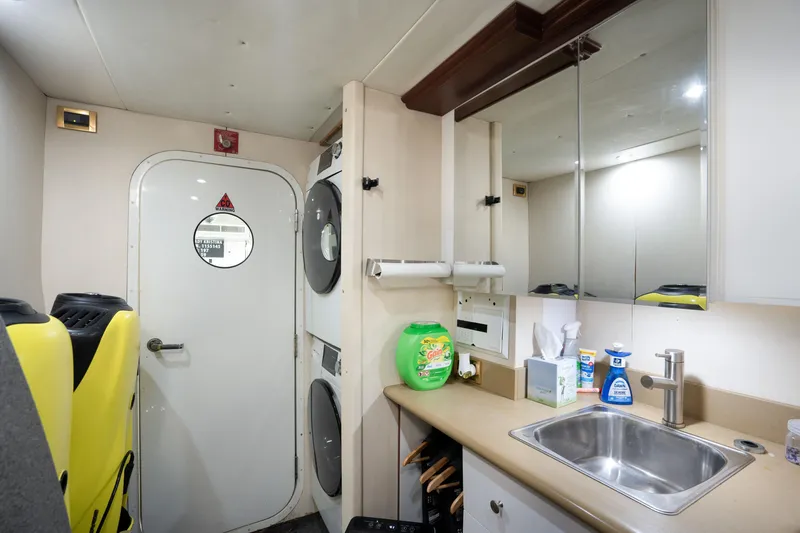 Slide: The Image of Laundry room on 2004 Lazzara 106 yacht with washer, dryer, and sink. - 66