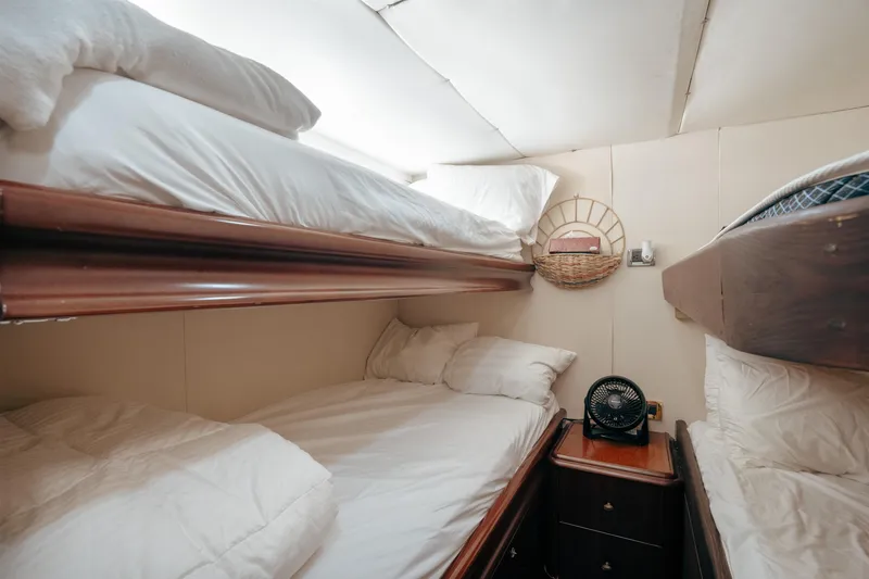 Slide: The Image of Cozy cabin with bunk beds in 2004 Lazzara 106 yacht interior. - 68