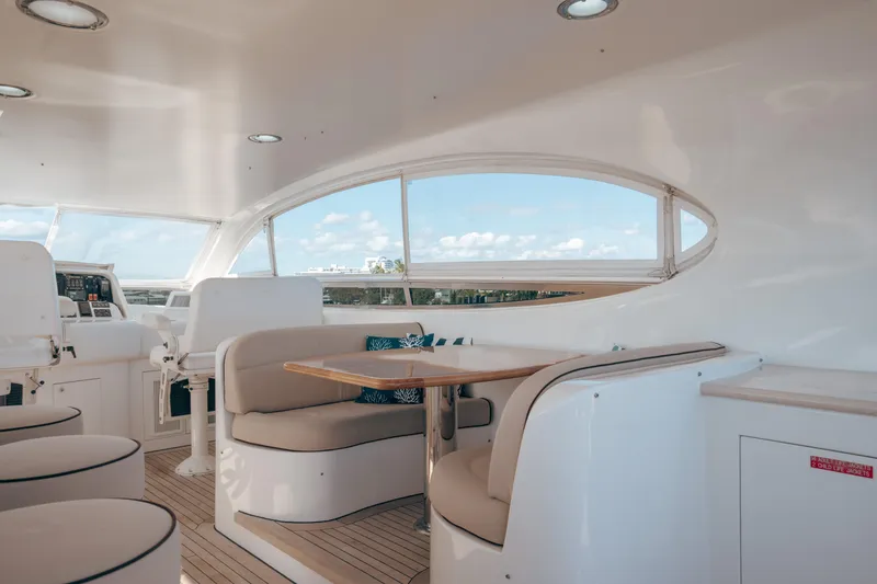 Slide: The Image of Luxurious interior of 2004 Lazzara 106 yacht with elegant seating and panoramic windows. - 16