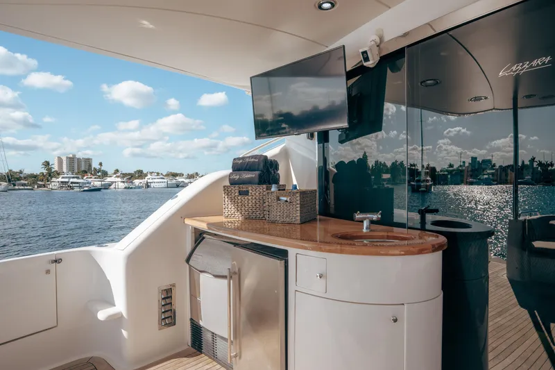 Slide: The Image of Luxurious 2004 Lazzara 106 yacht deck with sink, TV, and ocean view. - 29