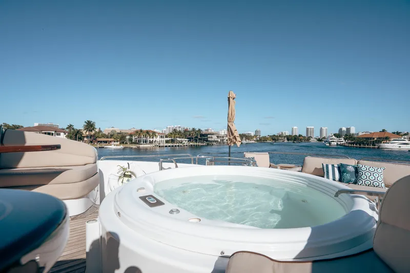 Slide: The Image of Luxurious 2004 Lazzara 106 yacht with jacuzzi, overlooking scenic waterfront and skyline. - 10