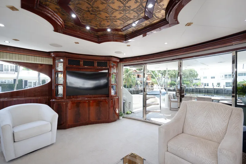 Slide: The Image of Luxurious interior of 2004 Lazzara 106 yacht with elegant seating and large windows. - 61