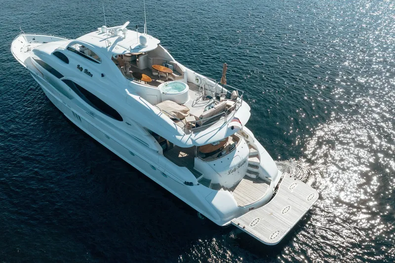 Slide: The Image of Luxurious 2004 Lazzara 106 yacht cruising on sparkling blue waters. - 5