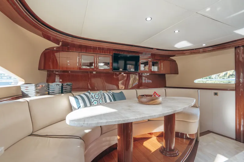 Slide: The Image of Luxurious interior of 2004 Lazzara 106 yacht with elegant seating and wooden accents. - 48