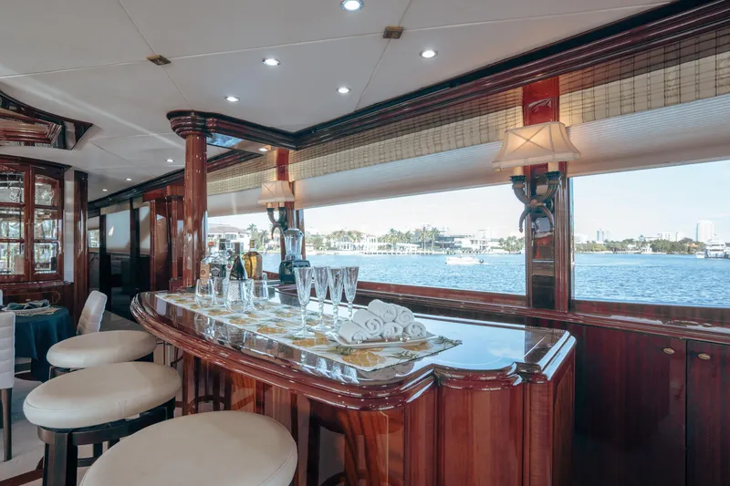 Slide: The Image of Luxurious interior of 2004 Lazzara 106 yacht with elegant bar and waterfront view. - 42