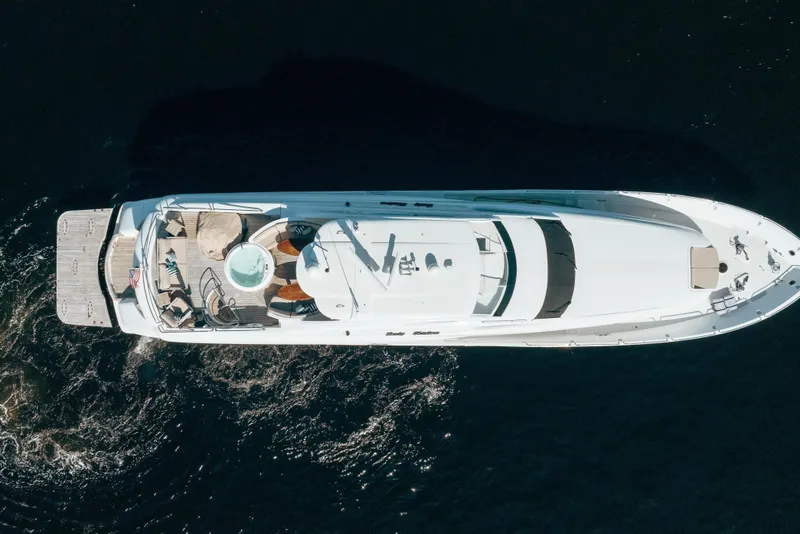 Slide: The Image of Aerial view of 2004 Lazzara 106 yacht cruising on dark water. - 4