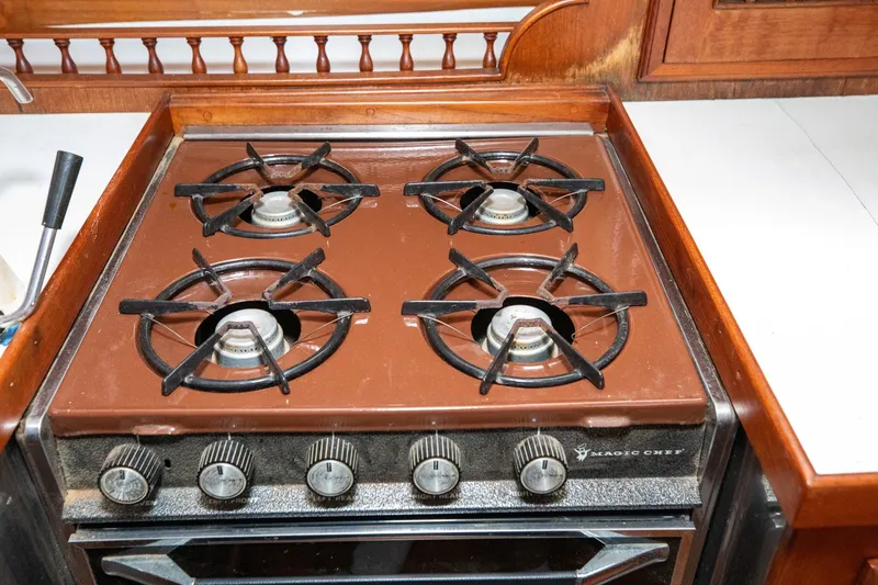 Slide: The Image of Vintage Magic Chef stove with four burners on a 1979 C&L Marine 36 boat. - 28