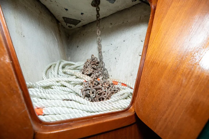 Slide: The Image of Interior of 1979 C&L Marine 36 boat showing rope and chain storage. - 42