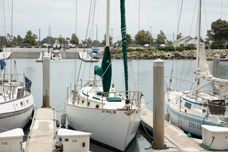 Slide: The Image of 1979 C&L Marine 36 sailboat docked at a marina with other boats. - 2