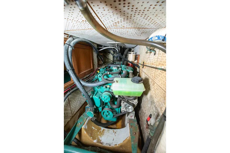 Slide: The Image of Engine compartment of a 1979 C&L Marine 36 boat, showcasing mechanical components. - 45