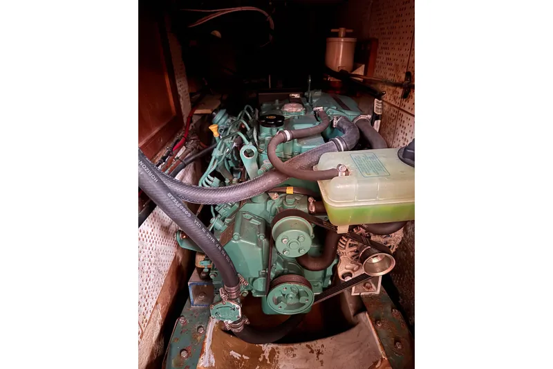 Slide: The Image of Engine compartment of a 1979 C&L Marine 36 boat, showcasing mechanical components. - 48