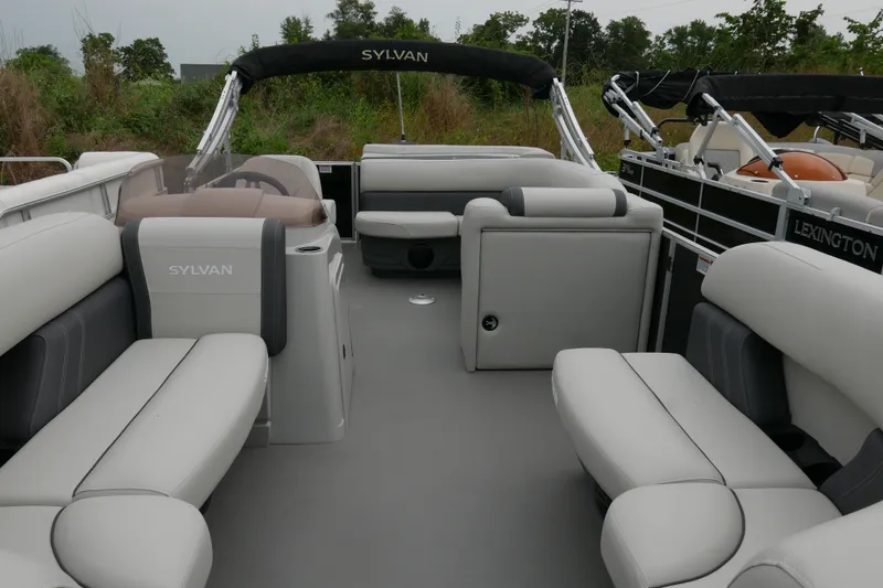 Slide: The Image of 2025 Sylvan Mirage 820 Cruise pontoon boat interior with plush seating and sleek design. - 4
