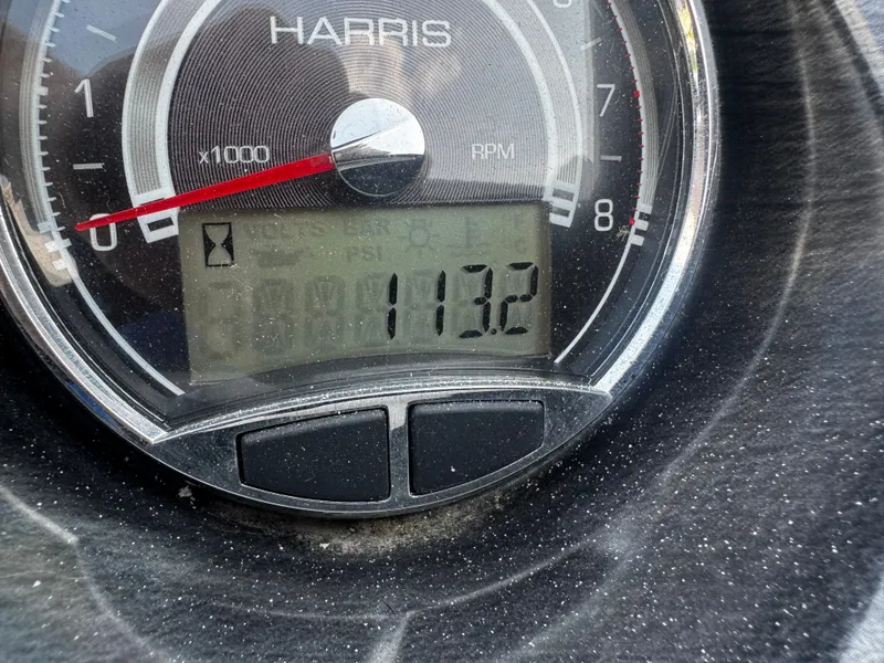 Slide: The Image of Close-up of a Harris Cruiser 230 tachometer showing 113.2 hours. - 15