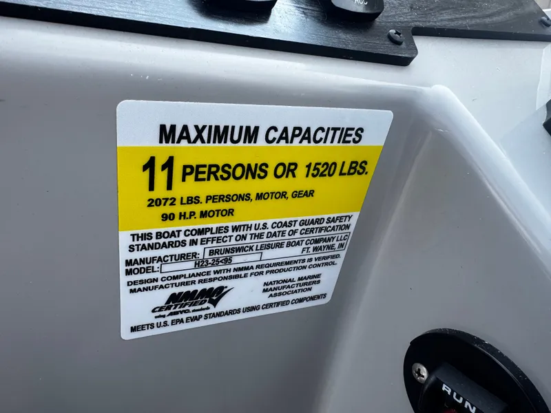 Slide: The Image of A sign on a boat shows the maximum capacity of 11 persons or 1520 pounds. - 17