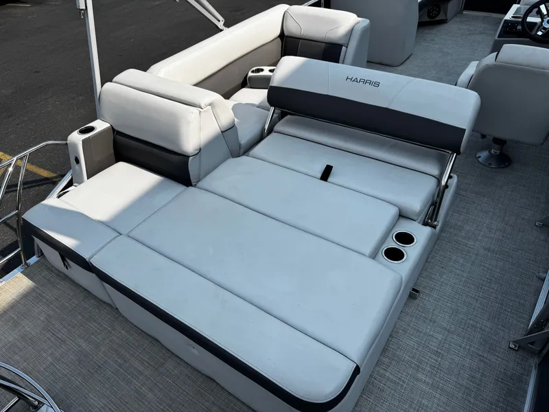 Slide: The Image of 2021 Harris Cruiser 230 with gray upholstery and cup holders. - 22