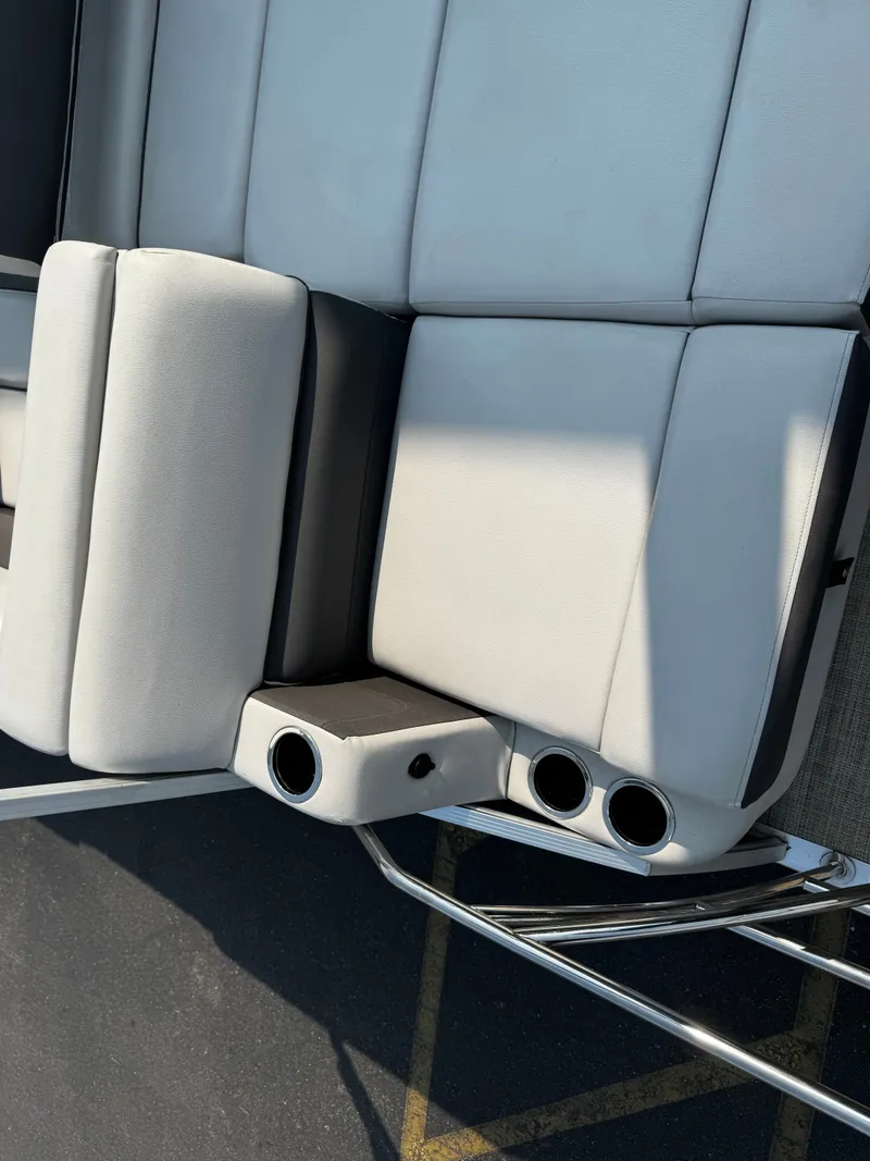 Slide: The Image of The image shows a white upholstered bench with cup holders on a 2021 Harris Cruiser 230. - 23