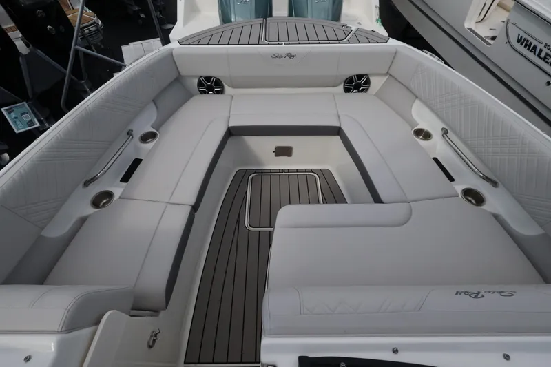 Slide: The Image of The image shows the seating area of a Sea Ray SDX 270 Outboard boat with sleek upholstery. - 26