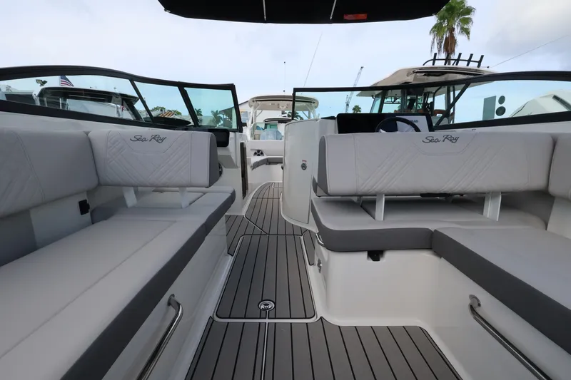 Slide: The Image of The image shows the spacious cockpit of a Sea Ray SDX 270 Outboard with sleek seating. - 11