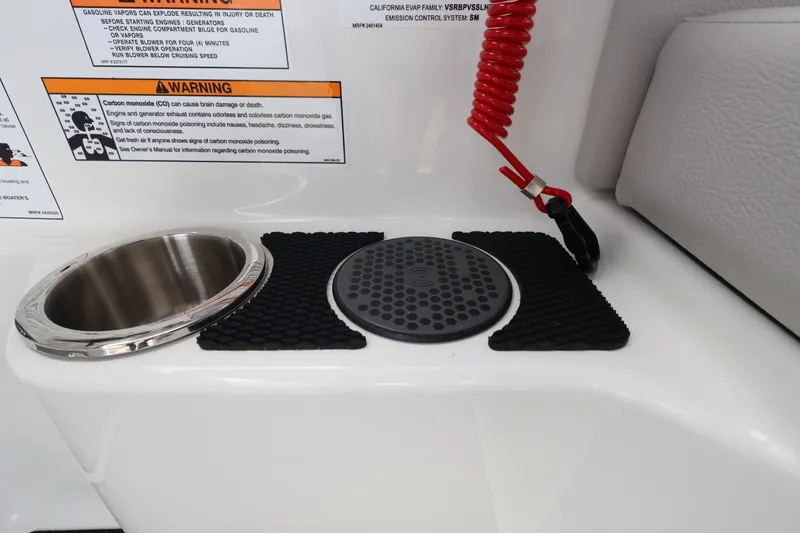 Slide: The Image of Close-up of a cup holder and safety lanyard on a 2027 Sea Ray SDX 270 Outboard. - 33