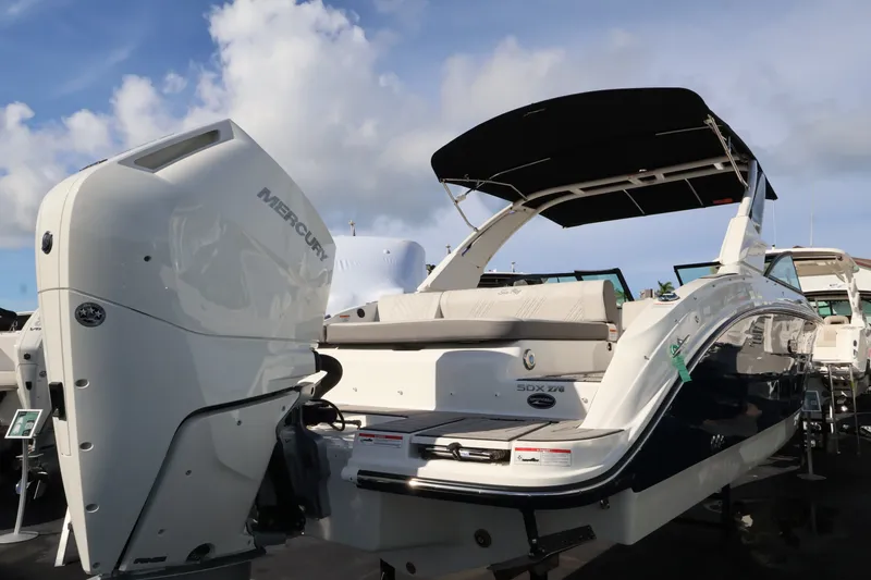 Slide: The Image of The image shows a Sea Ray SDX 270 Outboard boat with a large outboard motor. - 5