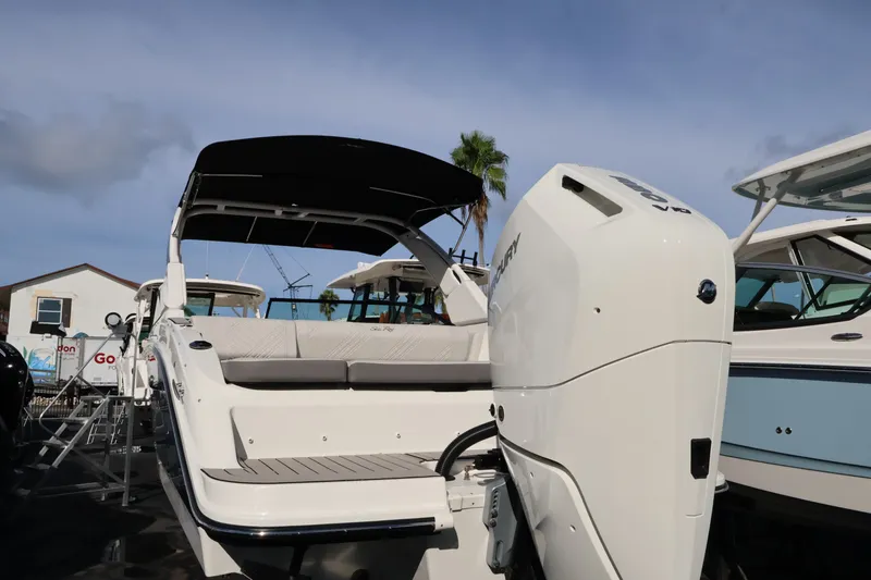Slide: The Image of The image shows a Sea Ray SDX 270 Outboard boat with a large outboard motor. - 3