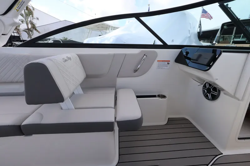 Slide: The Image of Interior of a Sea Ray SDX 270 Outboard with gray upholstery and modern fixtures. - 13